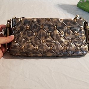 Gold studded clutch by Bebe. EUC